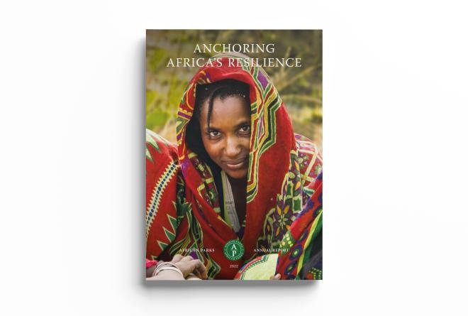 Annual Report 2022 Cover - Anchoring Africa's Resilience - African woman in smiling enigmatically at us